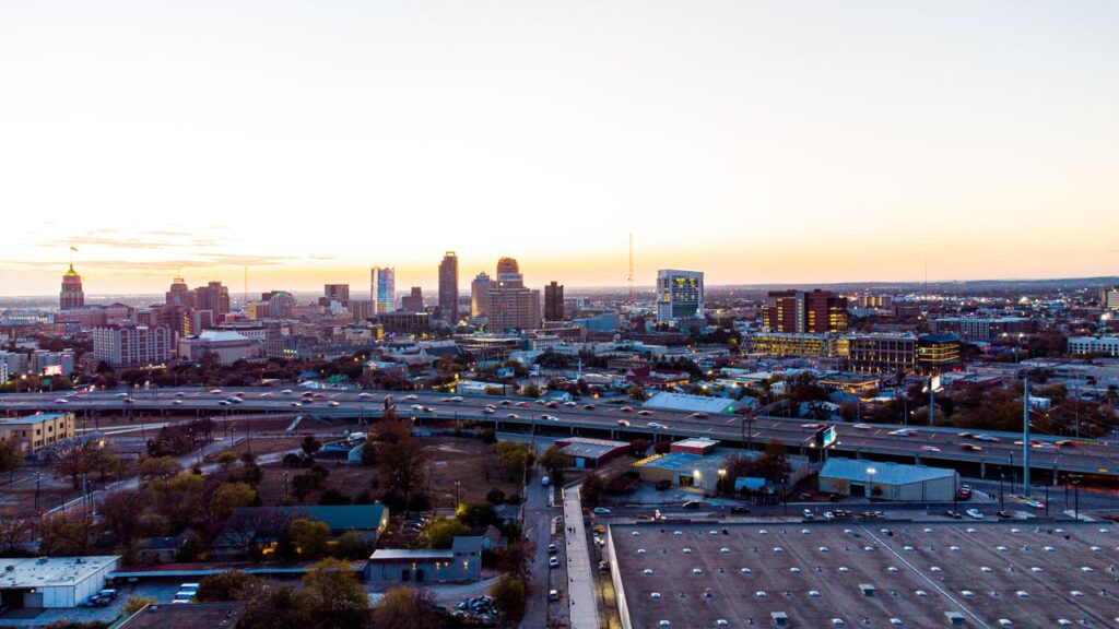 pexels-photo-10886795-10886795 A breathtaking aerial view of San Antonio's skyline during sunset, showcasing its urban charm and high-rise buildings.