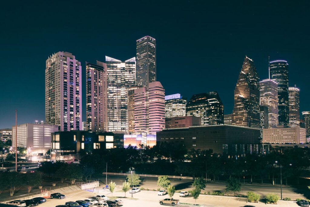 pexels-photo-18462185-18462185 Spectacular night view of the illuminated Houston skyline with modern skyscrapers.