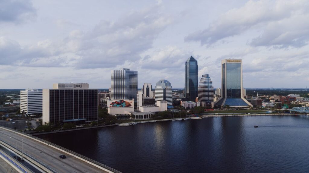 pexels-photo-20708698-20708698 A stunning aerial view of Jacksonville's modern skyline by the river under a cloudy sky.