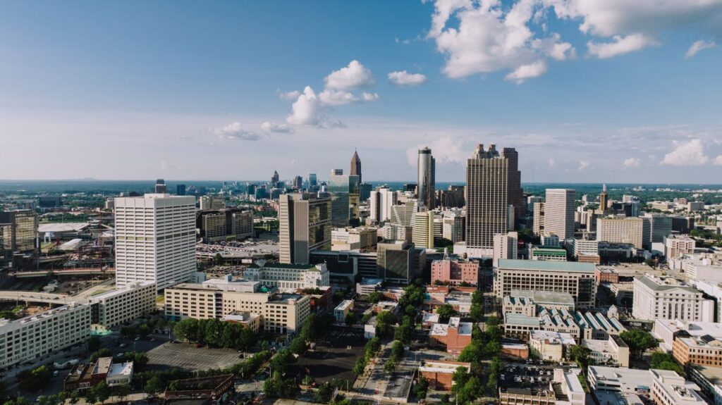 pexels-photo-33133738-33133738 Stunning aerial view of Atlanta's modern skyline under a clear blue sky.