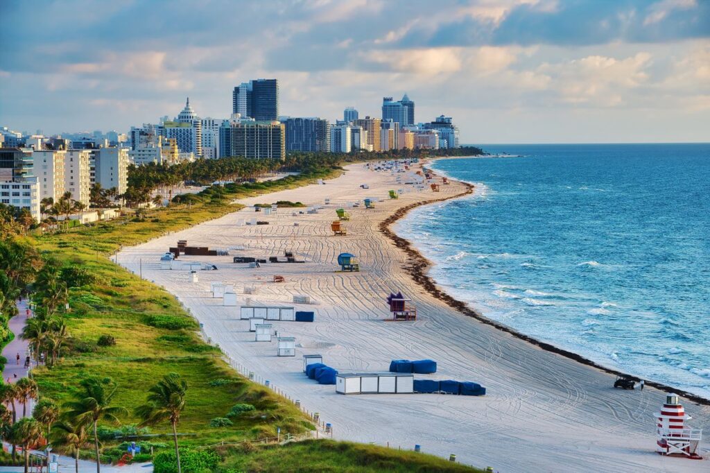 pexels-photo-8574669-8574669 Aerial photo of Miami Beach with skyline and ocean, showcasing a vibrant summer cityscape.